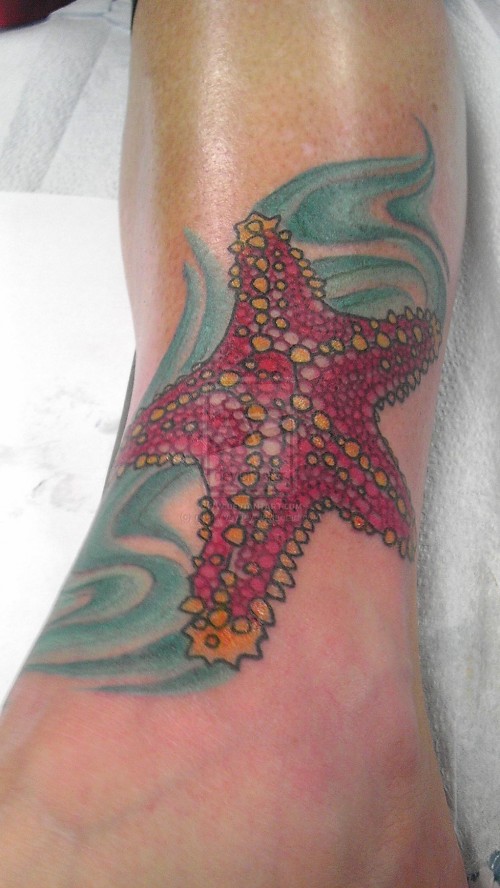 Nice Red Starfish With Blue Design Tattoo On Ankle