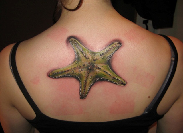 Nice Starfish Tattoo On Upper Back