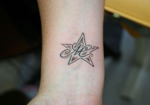 Nice Starfish With M Letter Tattoo On Wrist
