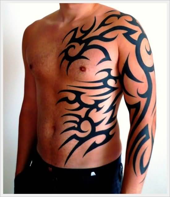 Nice Tribal Design Tattoo On Left Full Sleeve And Side Rib For Men