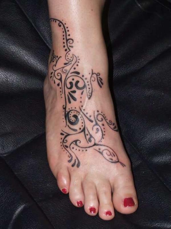 Nice Tribal Gecko Lizard Tattoo On Foot For Women