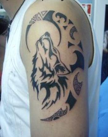 Nice Tribal Wolf Head With Half Moon Tattoo On Left Shoulder
