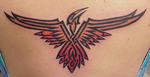 Orange Color Beautiful Tribal Bird Tattoo