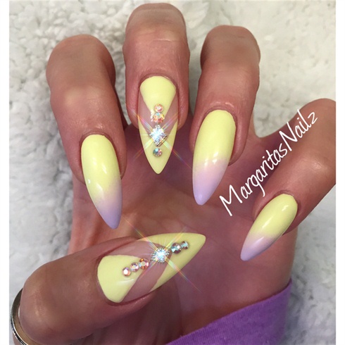 Pastel Yellow Stiletto Nails With Rhinestones Design Idea