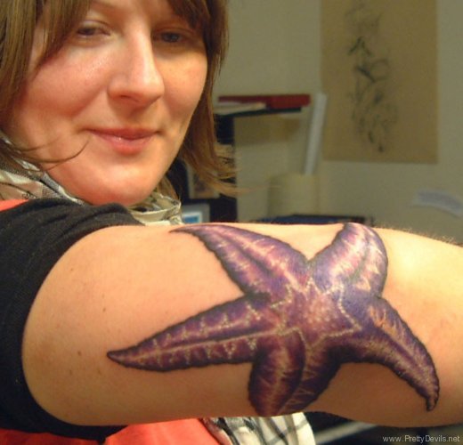 Purple Ink Starfish Tattoo On Right Elbow
