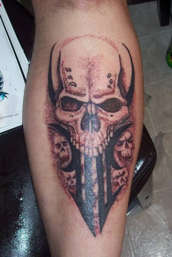 Realistic Colored Skulls With Tribal Design Tattoo On Forearm