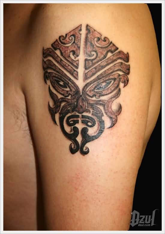 Realistic Colored Tribal Mask Tattoo On Left Shoulder