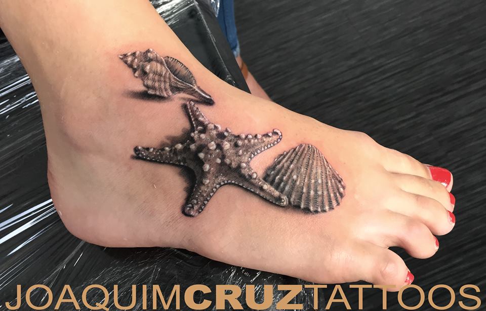 Realistic Grey Color Starfish With Seashell And Conch Tattoo On Foot