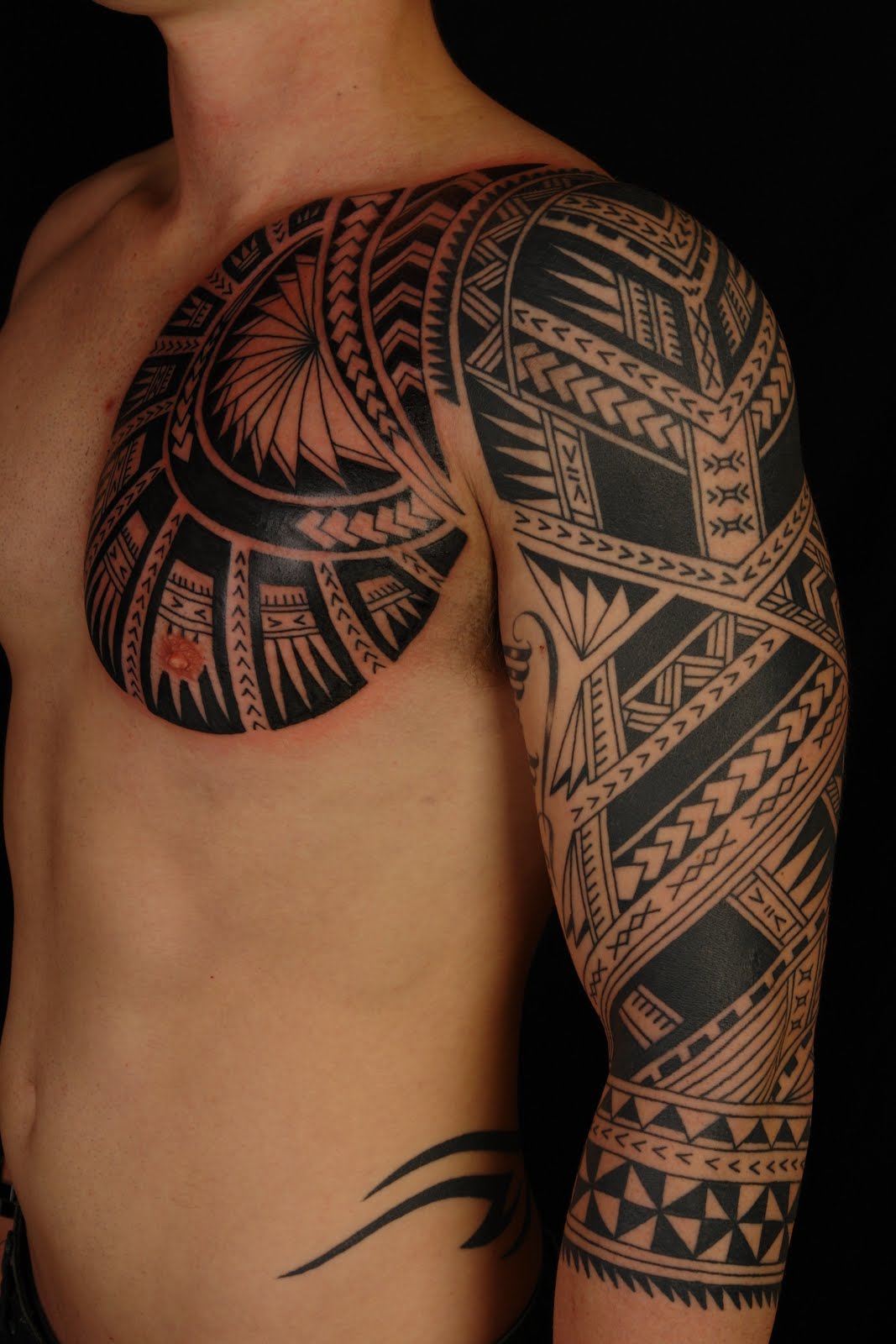 Samoan Tattoo On Chest And Left Sleeve