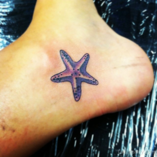 Simple And Small Purple Starfish Tattoo On Foot.