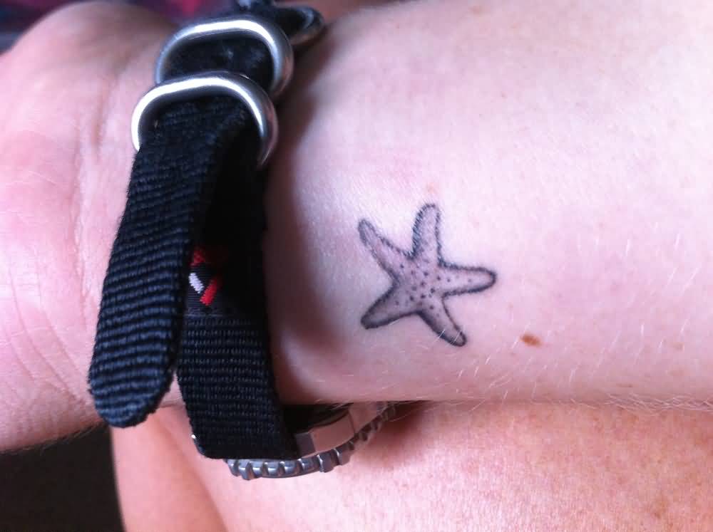 Simple And Small Starfish Tattoo On Wrist