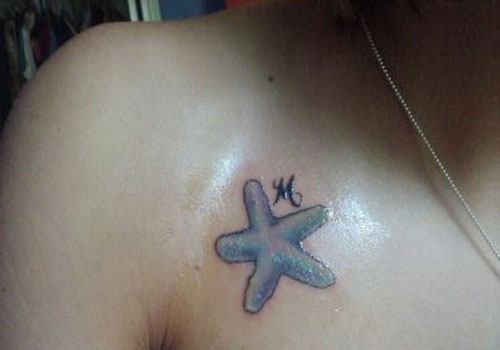 Simple Blue Color Starfish Tattoo On Collar Bone