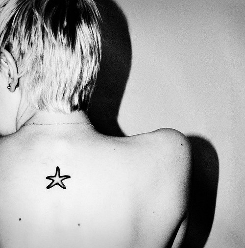 Simple Colorless Starfish Tattoo On Back