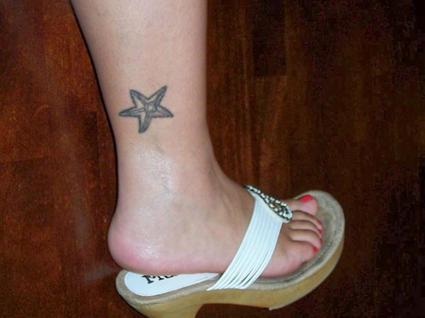 Simple Grey Color Starfish Tattoo On Foot