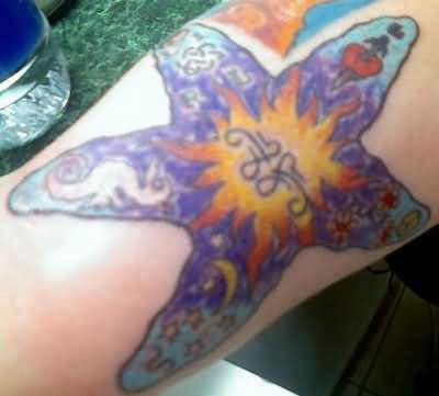 Simple Purple Ink Starfish Tattoo On Forearm