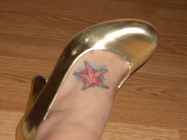 Simple Red Starfish Tattoo On Foot
