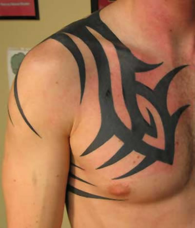 Simple Tribal Design Tattoo On Right Chest