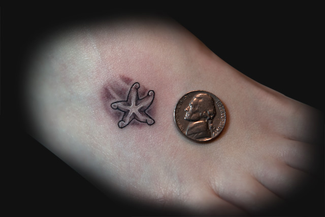 Small Grey Ink Starfish Tattoo On Foot
