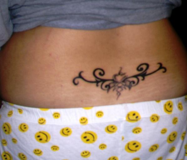 Small Tribal Design Tattoo On Lower Back For Women