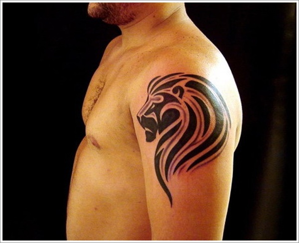 Small Tribal Lion Head Tattoo On Left Shoulder