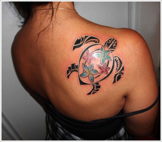 Small Tribal Turtle Having Colorful Flowers On Body Tattoo On Right Back Shoulder