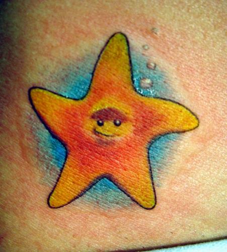 Smiley On Orange Starfish Tattoo