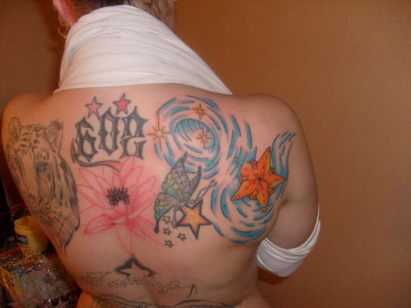 Starfish With Butterfly Star And Water Tattoo On Upper Back
