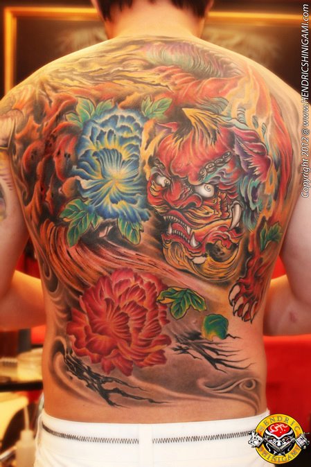 Stunning Colorful Foo Dog With Flowers Tattoo On Full Back