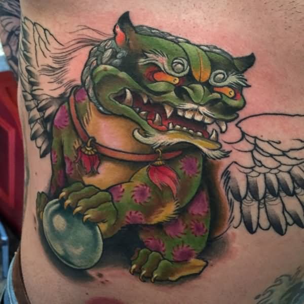 Superb Angry Foo Dog With Angel Wings Tattoo