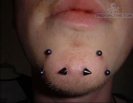 Surface Chin Piercings With Spike Black Barbell