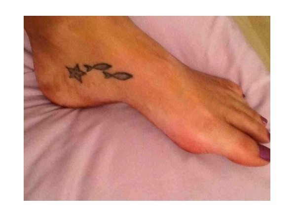 Tiny And Simple Starfish With Fishes Tattoo On Foot