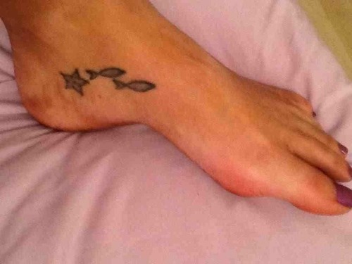 Tiny Starfish And Fishes Tattoo On Foot