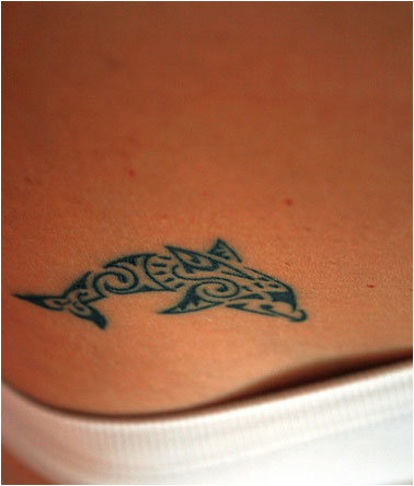 Tiny Tribal Whale Tattoo On Hip