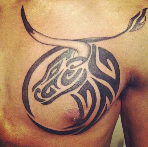 Tribal Wolf In Circle Tattoo On Chest For Men