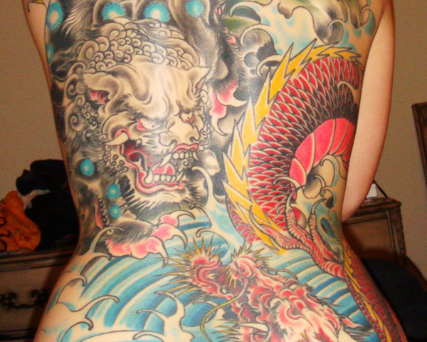 Very Nice Colorful Foo Dog With Dragon Tattoo On Full Back