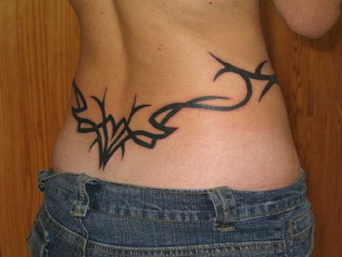 Very Nice Tribal Design Tattoo On Lower Back For Women
