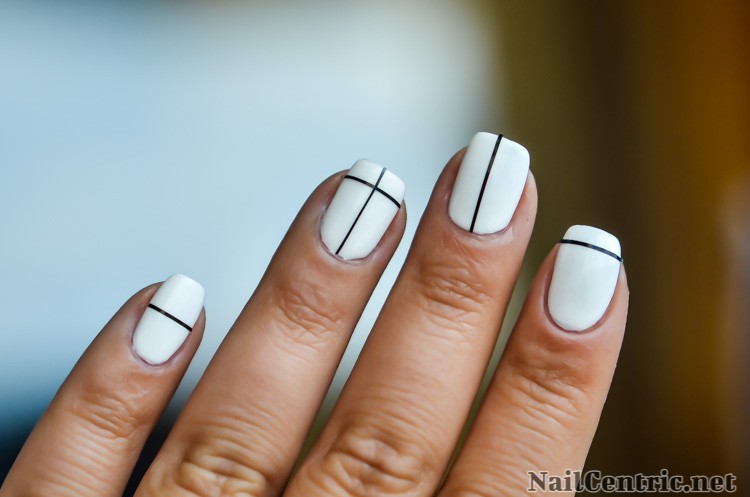 White Base Nails With Black Striped Nail Art
