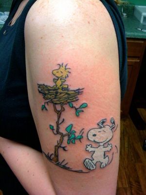White Snoopy Tattoo On Left Half Sleeve
