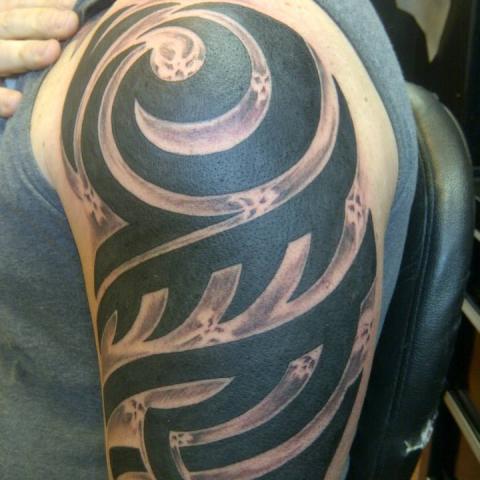 Wonderful Black And Grey Tribal Design Tattoo On Left Shoulder