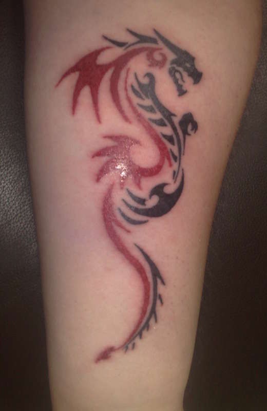 Wonderful Tiny Black Red Tribal Dragon Tattoo On Forearm