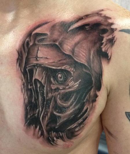 Amazing Black And Grey Evil Grim Face Tattoo On Left Chest