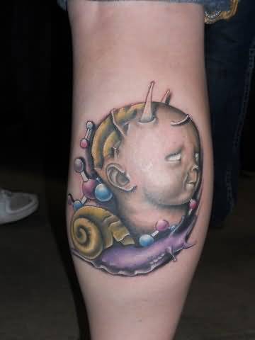 Amazing Kid Head And Snail Tattoo On Leg