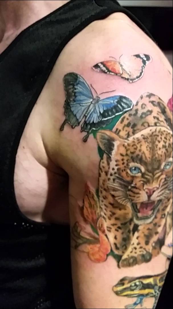 Amazing Roaring Jaguar With Butterflies Tattoo On Left Shoulder
