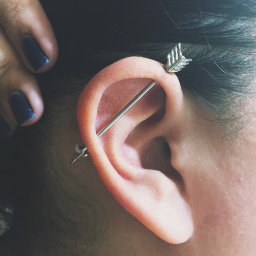 Arrow Industrial Piercing On Girl Right Ear