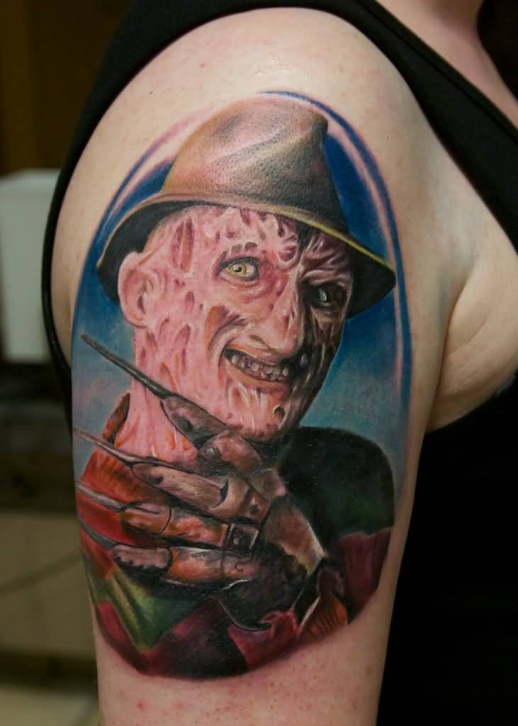 Attractive Colorful Freddy Krueger In Circle Tattoo On Right Shoulder