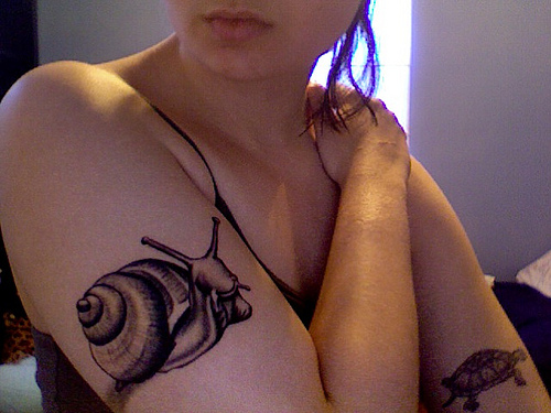 Attractive Grey Ink Snail Tattoo On Right Half Sleeve For Girl