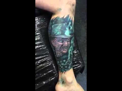 Awesome Blue Freddy Krueger Flaming Tattoo On Leg By Piotr Cwiek