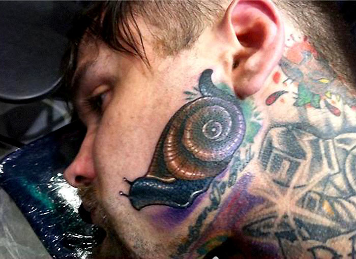 Awesome Snail Colorful Tattoo On Face