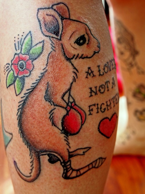 Baby Boxer Kangaroo With Lettering Traditional Tattoo On Back Leg