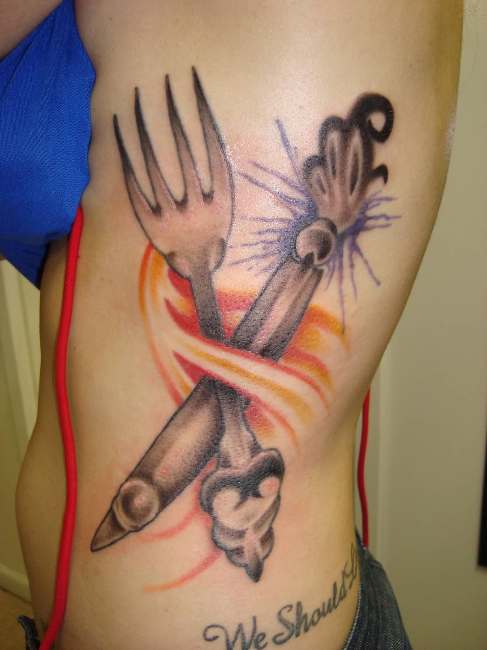 Beautiful And Large Grey Vintage Crossed Fork And Knife Tattoo On Side Rib
